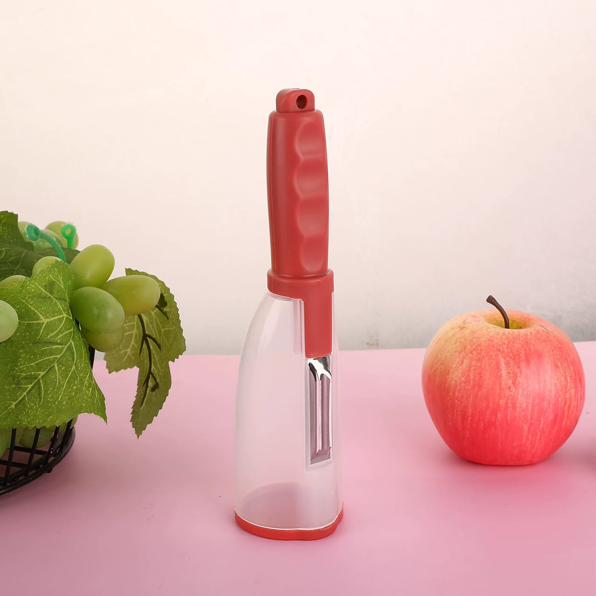 Éplucheur de légumes avec récipient intégré