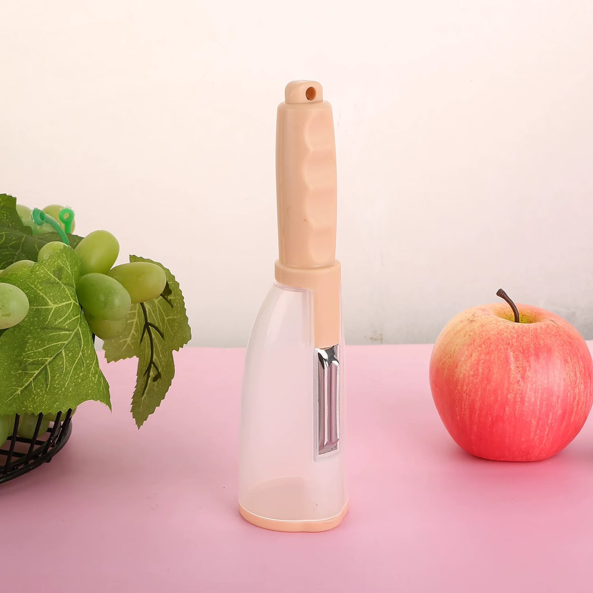 Éplucheur de légumes avec récipient intégré